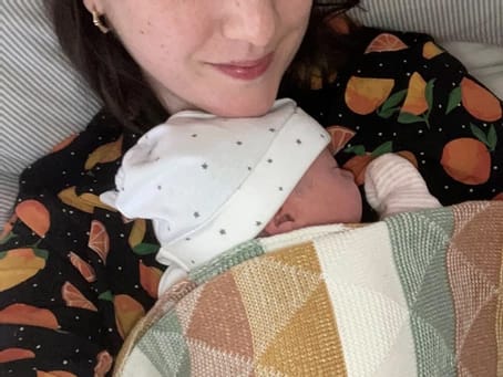 Photo of baby asleep on mother